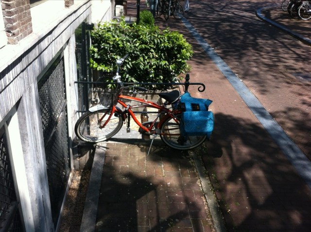 My orange bike parked in the shade by Jeff's office on the Keizersgracht